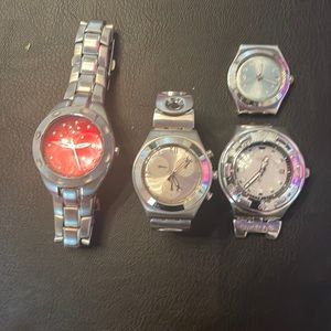 Watches and parts.  One fossil and the rest Swatch watch.